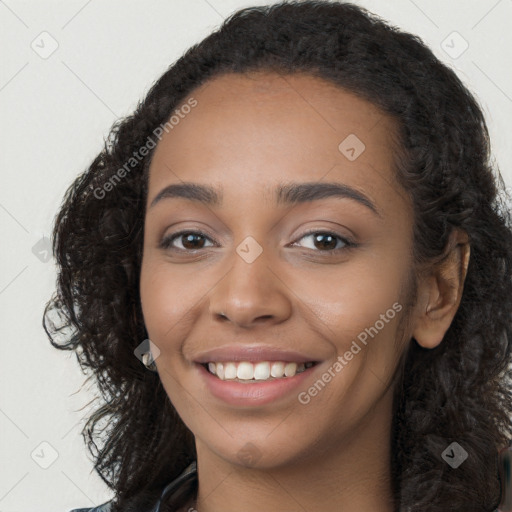 Joyful latino young-adult female with long  black hair and brown eyes