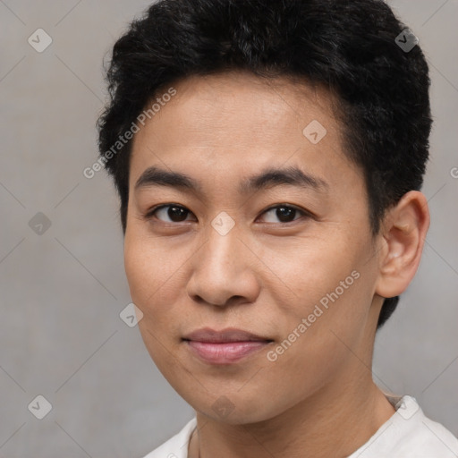 Joyful latino young-adult male with short  brown hair and brown eyes