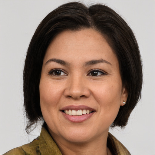Joyful white adult female with medium  brown hair and brown eyes