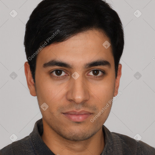 Joyful latino young-adult male with short  black hair and brown eyes