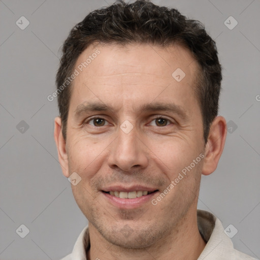 Joyful white adult male with short  brown hair and brown eyes