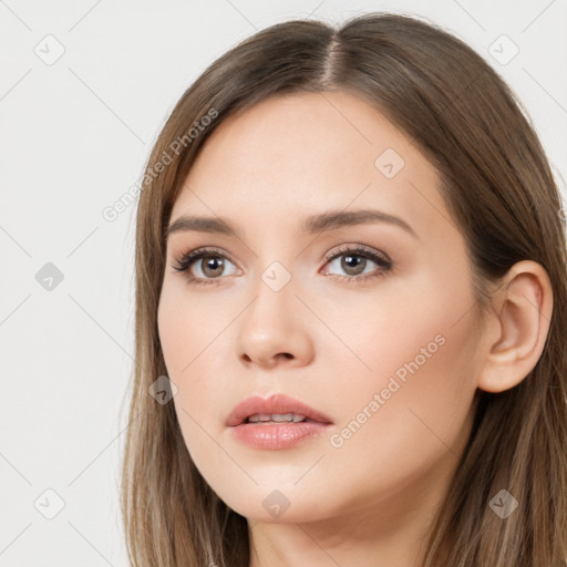 Neutral white young-adult female with long  brown hair and brown eyes