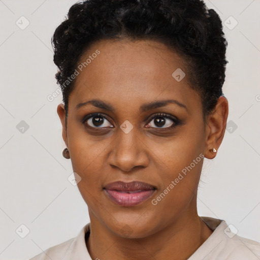 Joyful black young-adult female with short  black hair and brown eyes