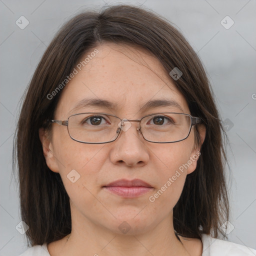 Joyful white adult female with medium  brown hair and brown eyes