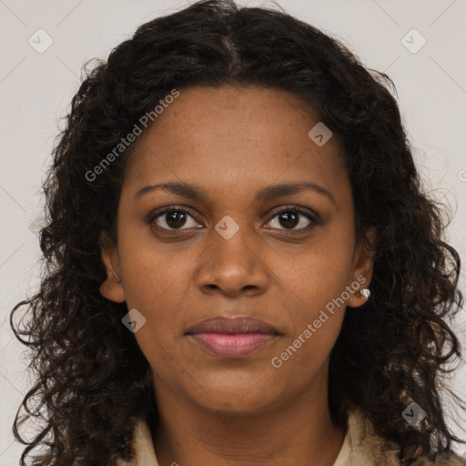 Joyful black young-adult female with long  brown hair and brown eyes