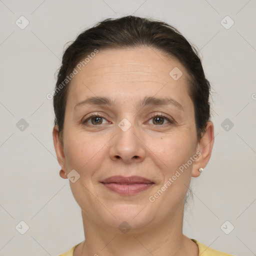 Joyful white adult female with short  brown hair and brown eyes