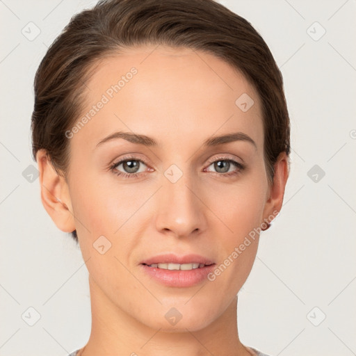 Joyful white young-adult female with short  brown hair and grey eyes