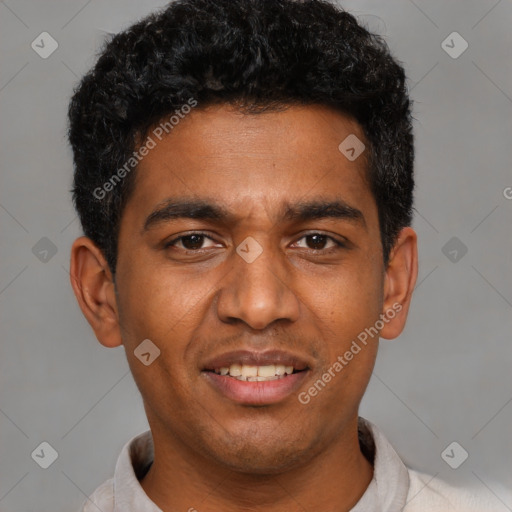 Joyful black young-adult male with short  black hair and brown eyes