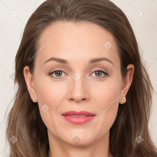 Joyful white adult female with long  brown hair and grey eyes