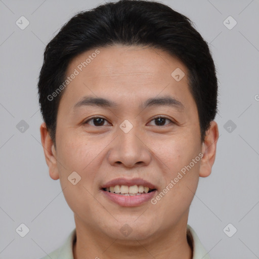 Joyful asian young-adult male with short  brown hair and brown eyes