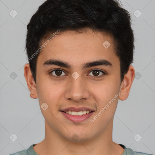 Joyful latino young-adult male with short  brown hair and brown eyes