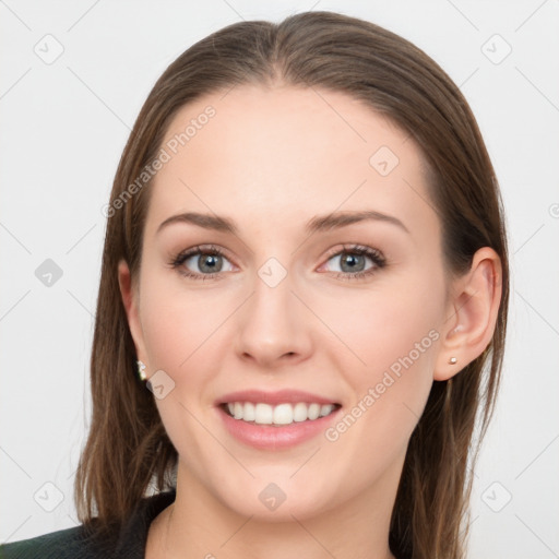 Joyful white young-adult female with long  brown hair and grey eyes