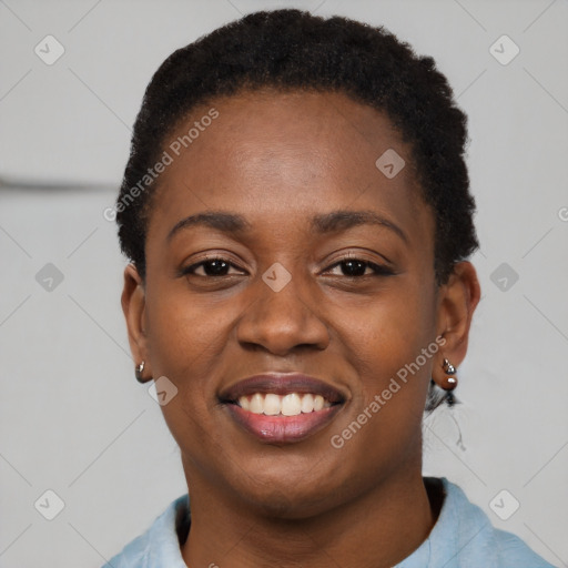 Joyful black young-adult female with short  black hair and brown eyes