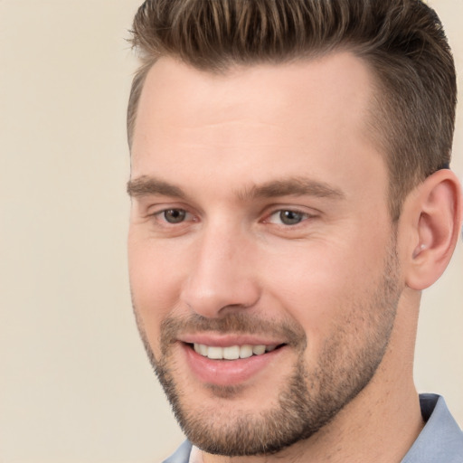 Joyful white young-adult male with short  brown hair and brown eyes