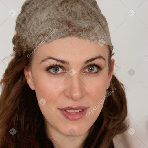 Joyful white young-adult female with long  brown hair and green eyes