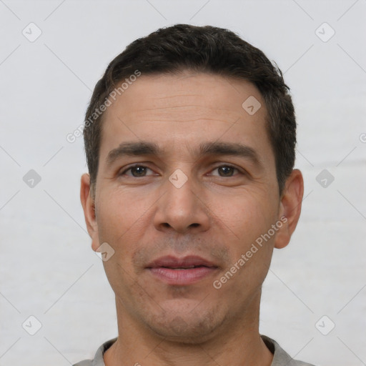 Neutral white adult male with short  black hair and brown eyes