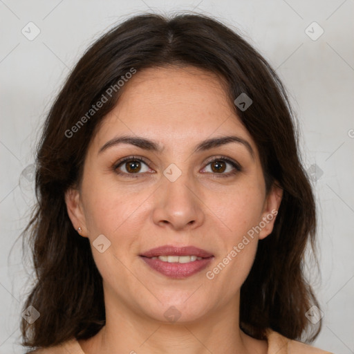 Joyful white adult female with medium  brown hair and brown eyes