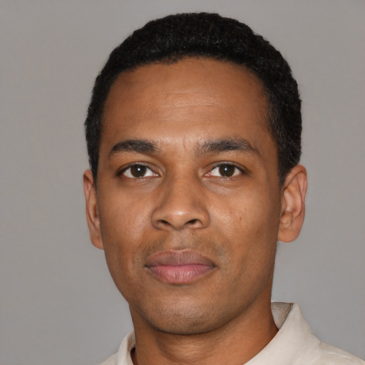 Neutral black young-adult male with short  black hair and brown eyes
