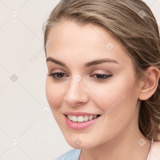 Joyful white young-adult female with long  brown hair and blue eyes