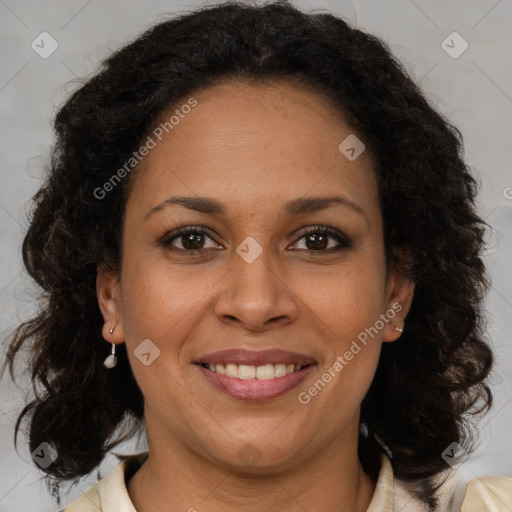 Joyful latino adult female with medium  brown hair and brown eyes