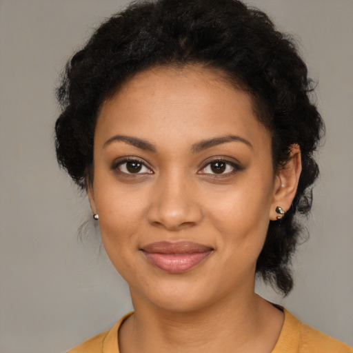 Joyful latino young-adult female with medium  black hair and brown eyes