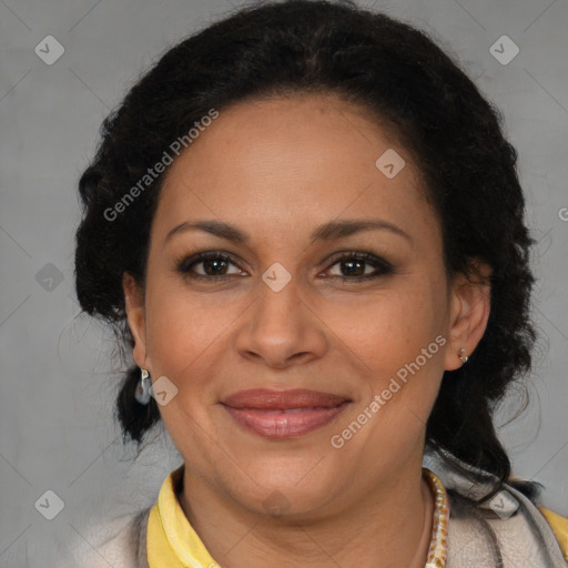 Joyful latino adult female with medium  brown hair and brown eyes