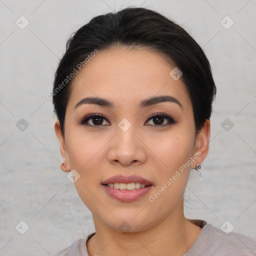 Joyful asian young-adult female with short  black hair and brown eyes