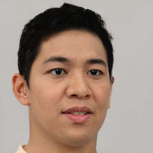 Joyful asian young-adult male with short  brown hair and brown eyes