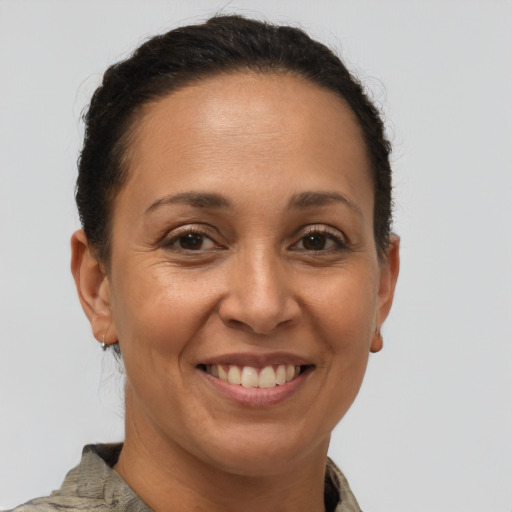 Joyful white adult female with short  brown hair and brown eyes