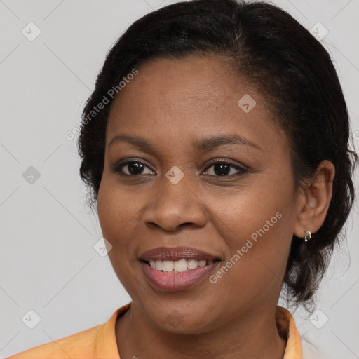 Joyful black young-adult female with medium  brown hair and brown eyes