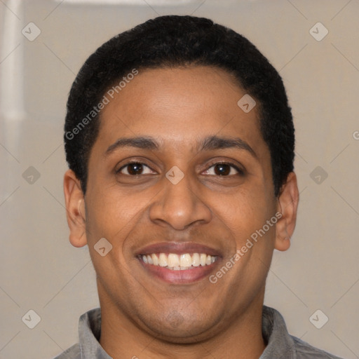 Joyful latino young-adult male with short  black hair and brown eyes