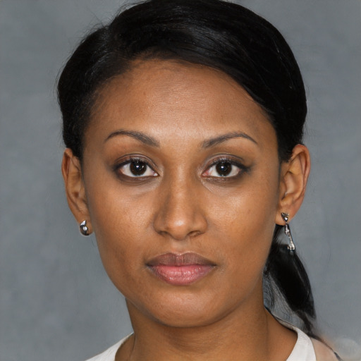Neutral black young-adult female with short  brown hair and brown eyes