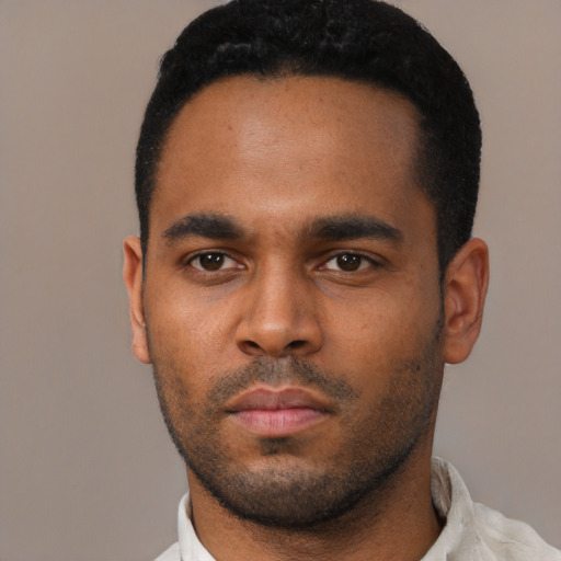 Neutral black young-adult male with short  black hair and brown eyes