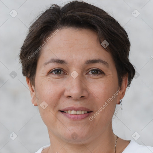 Joyful white adult female with short  brown hair and brown eyes