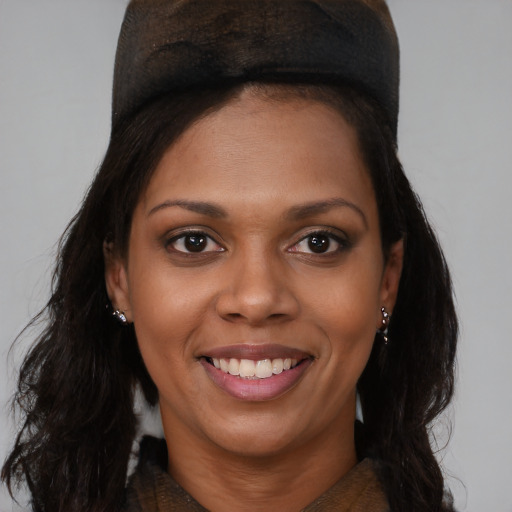 Joyful black young-adult female with medium  brown hair and brown eyes