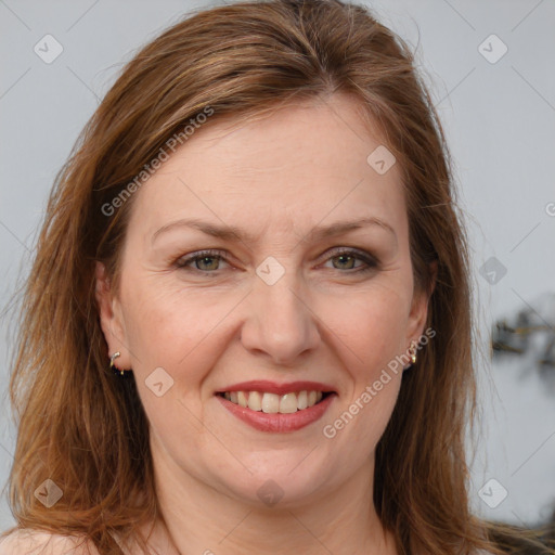 Joyful white adult female with long  brown hair and brown eyes