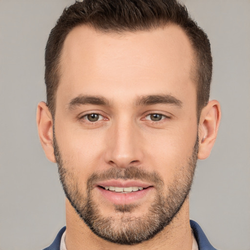 Joyful white young-adult male with short  brown hair and brown eyes