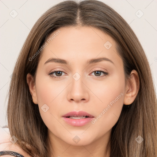 Neutral white young-adult female with long  brown hair and brown eyes