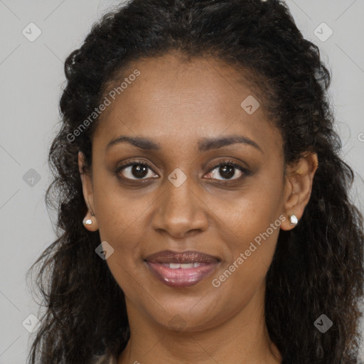 Joyful black young-adult female with long  brown hair and brown eyes