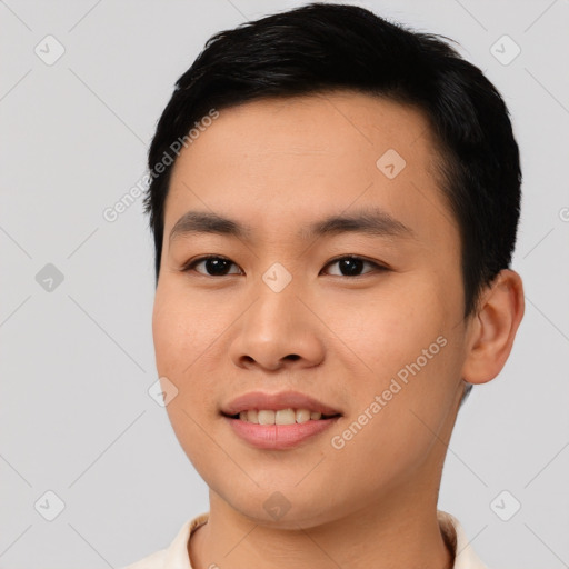 Joyful asian young-adult male with short  black hair and brown eyes