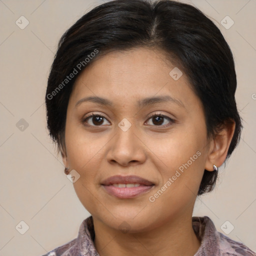 Joyful latino young-adult female with medium  brown hair and brown eyes