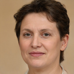 Joyful white adult female with short  brown hair and brown eyes