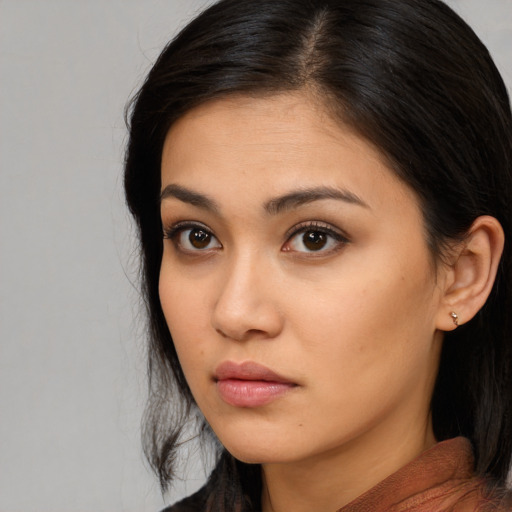 Neutral asian young-adult female with long  brown hair and brown eyes