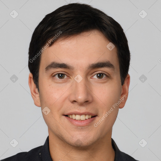 Joyful white young-adult male with short  black hair and brown eyes