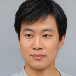 Neutral asian young-adult male with short  black hair and brown eyes