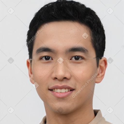 Joyful asian young-adult male with short  black hair and brown eyes