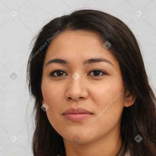 Joyful latino young-adult female with long  brown hair and brown eyes