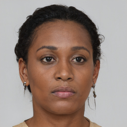 Neutral black young-adult female with short  brown hair and brown eyes