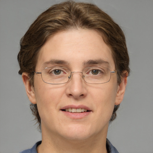 Joyful white adult female with medium  brown hair and green eyes