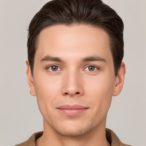 Joyful white young-adult male with short  brown hair and brown eyes